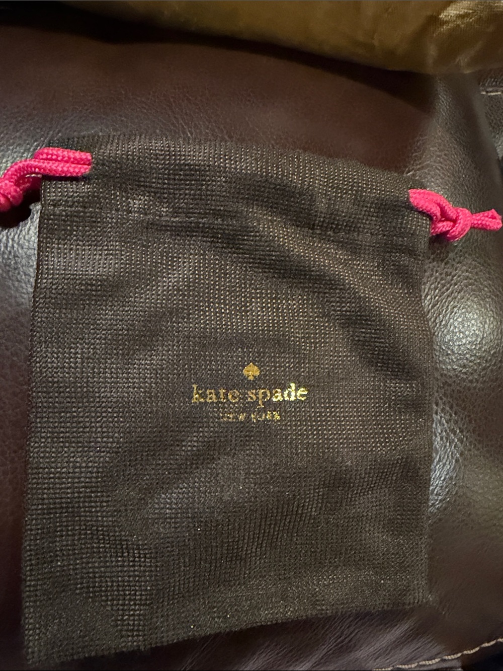 Kate spade brown jewelry pouch with pink drawstring